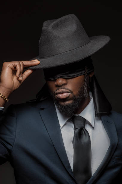 istock Blindfolded elegant black male posing for studio portrait 1486226612