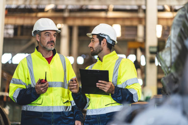 istock professional technician engineer with safety hard hat working to maintenance construction equipment in industrial factory, inspection man having manufacturing occupation job of production technology 1486226647