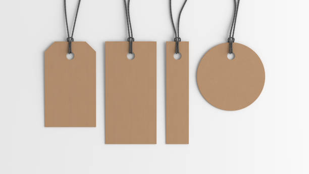istock Cardboard tags of various shapes mockup on white background. View directly above 1486227977