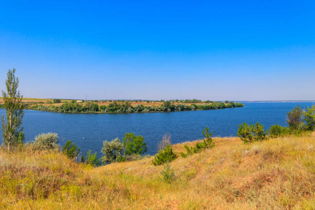 istock Summer landscape with beautiful river, green trees and blue sky 1486229724
