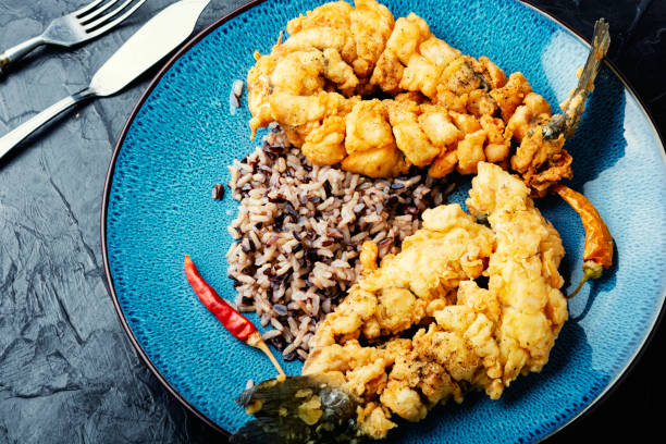 istock Breaded fish and rice on the plate. 1486229911