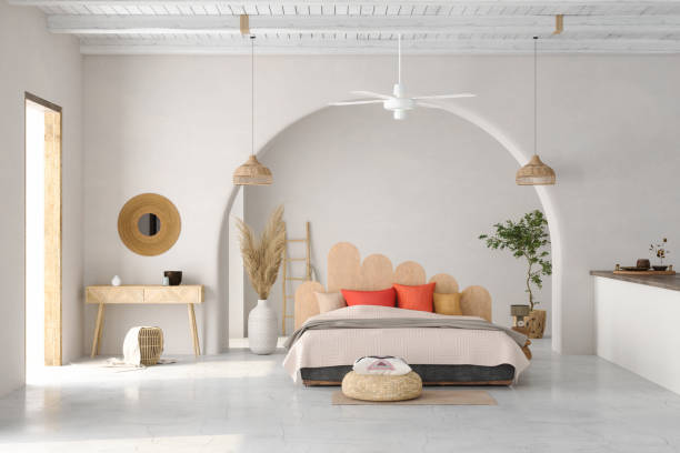 nowoczesne wnętrze sypialni z podwójnym łóżkiem, wiklinowymi lampami, czerwonymi poduszkami i rośliną doniczkową - double bed headboard hotel room design zdjęcia i obrazy z banku zdjęć