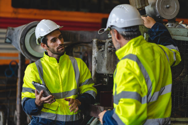 istock professional technician engineer with safety hard hat working to maintenance construction equipment in industrial factory, inspection man having manufacturing occupation job of production technology 1486234837