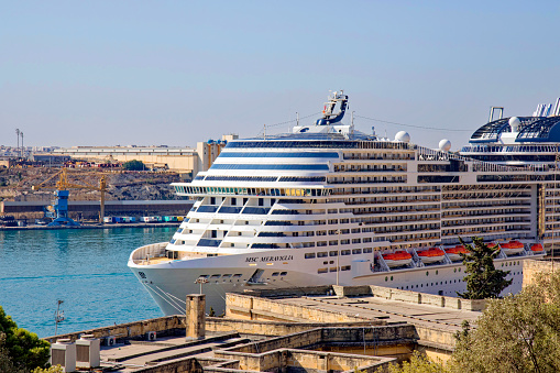Cruise ship named MSC Meraviglia at port of Valletta on a sunny hot summer day. Photo taken August 9th, 2017, Valletta, Malta.