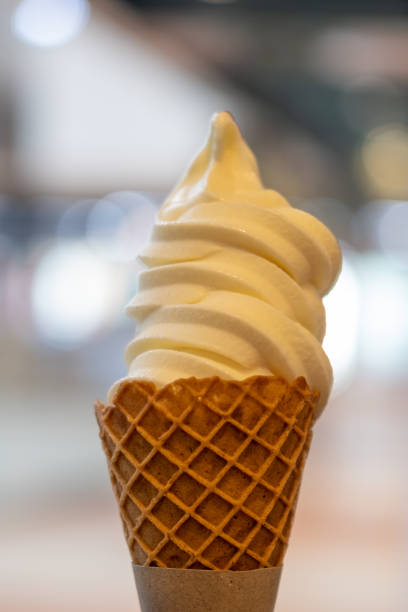 istock Vanilla Ice cream with waffle cone. blur background. 1486238612