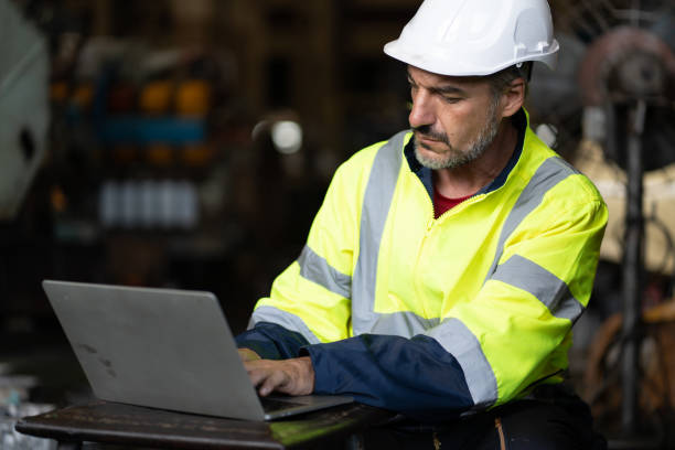 istock professional technician engineer with safety hard hat working to maintenance construction equipment in industrial factory, inspection man having manufacturing occupation job of production technology 1486239778