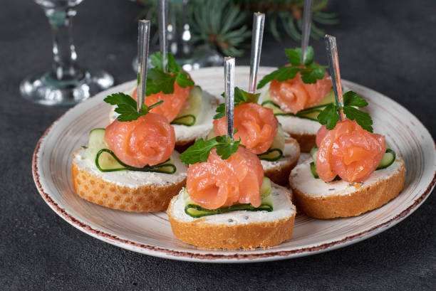 istock Festive canape with salted salmon, cucumber and soft cheese 1486255941