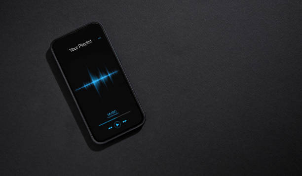 istock Smartphone with music player app open on screen on dark gray background 1486260665