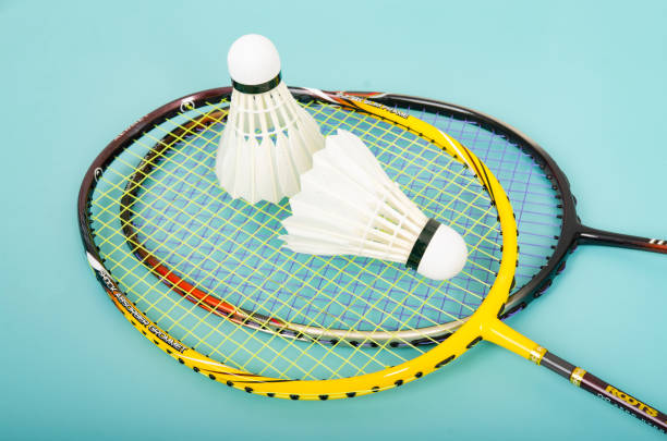 istock shuttlecock on badminton racket on colored paper background 1486272026
