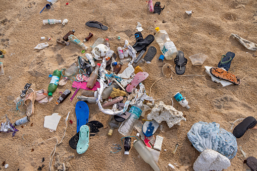 Trincomalee, North Western Province, Sri Lanka - March 2nd 2023: Plastic garbage collected at the waterfront and left in a pile close to the beach