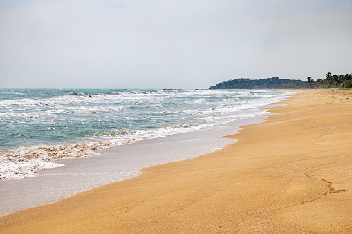 A clean part of the tropical beach facing the Indian Ocean north of Trincomalee in the Easter Province in Sri Lanka