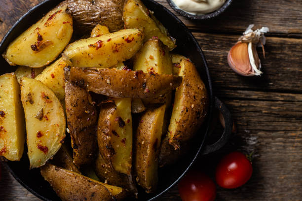 istock Sliced ​​baked potatoes with sauces 1486278350