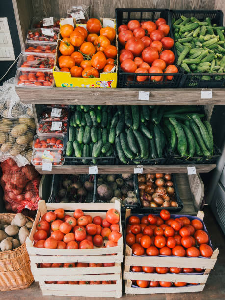 istock Boxes with fresh vegetables are on the shelves in the store 1486280159
