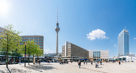 High resolution panorama of the Alexanderplatz in Berlin against blue sky.