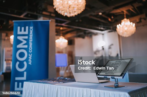 istock APAC registration counter with digital tablet display QR code for self check in at hotel business conference entrance hall 1486286570
