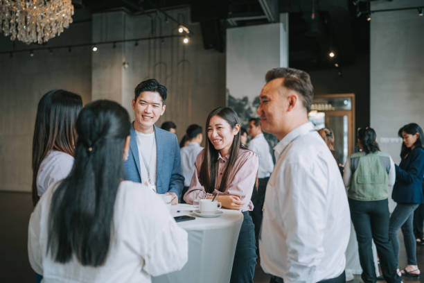 istock Diversify Asian seminar participants casual chat after successful conference event at lounge 1486286670