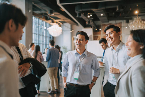 istock Diversify Asian seminar participants casual chat after successful conference event at lounge 1486286685