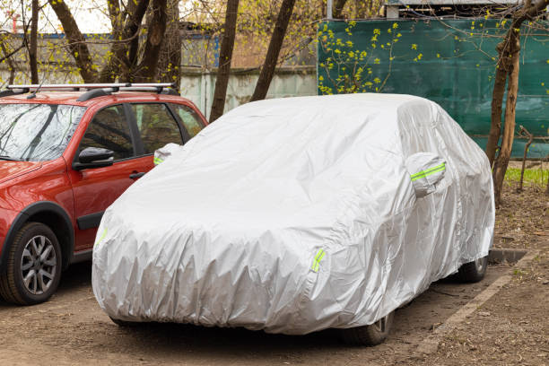 istock car cover to protect from the sun and rain 1486286923