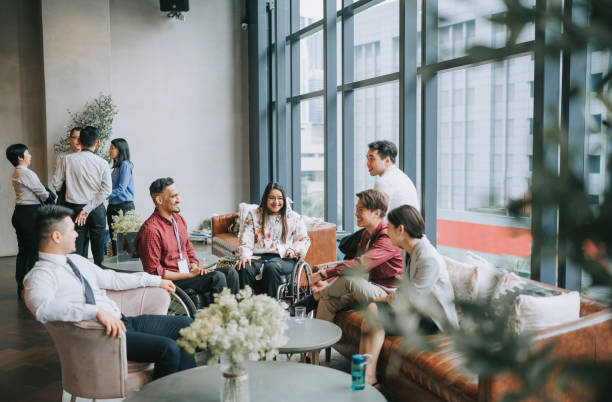 istock Diversify Asian seminar participants casual chat after successful conference event at lounge 1486286977