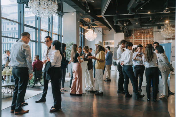 Group of multiracial Asian business participants casual chat after successful conference event Group of multiracial Asian business person coffee break social gathering after seminar business conference after work stock pictures, royalty-free photos & images