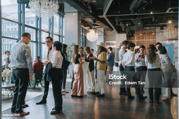 Group Of Multiracial Asian Business Participants Casual Chat After Successful Conference Event Stock Photo - Download Image Now