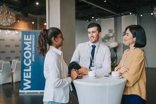 Asian Multiethnic business people talk during a coffee break in Seminar Business conference