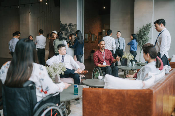 istock Diversify Asian seminar participants casual chat after successful conference event at lounge 1486287724