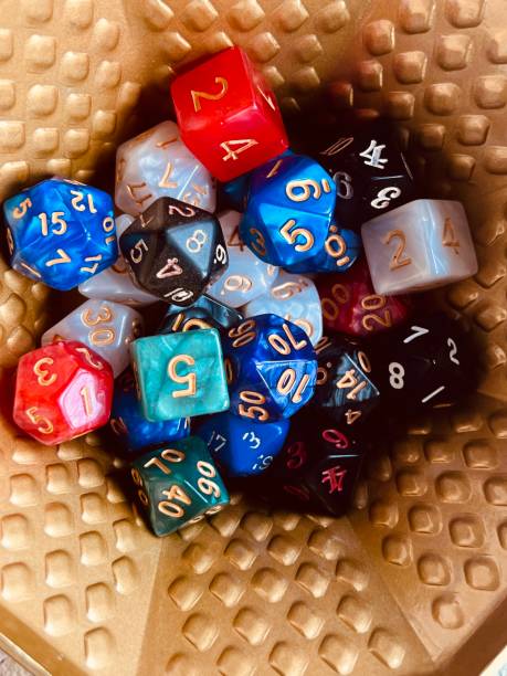 istock Role Playing Dice in Gold Pot 1486288105