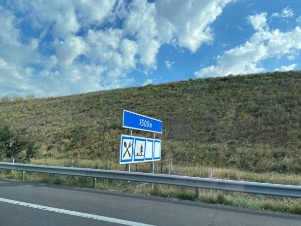 istock French highway with road sign indicating rest area. 1486296534