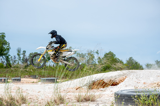 A shot of a motocross rider in air during a race