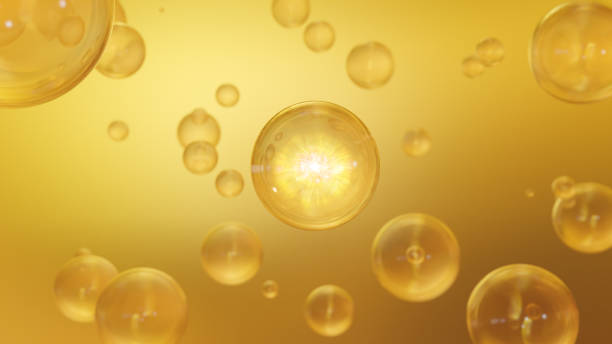 Cosmetic 3d Golden liquid bubbles on a bright background stock photo