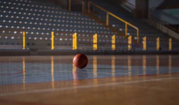 Basketball Ball On Wooden Court stock photo