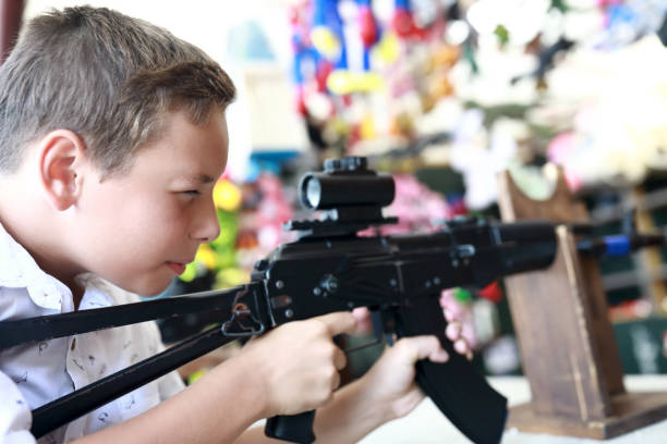 istock Child shoots air rifle 1486313323