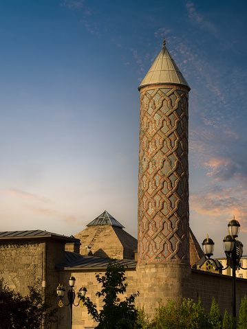 Historical Yakutiye Madrasa at sunset time. It is one of the symbols of Erzurum province. Türkiye travel destinations. Turkey