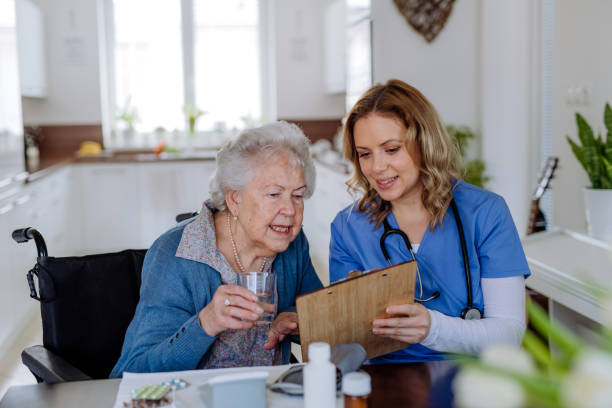 istock Nurse explaining how to dose medicines to senior woman. 1486314017