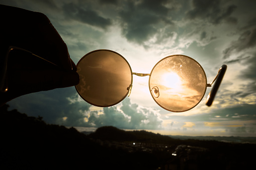 Glasses on a books in the sunset. Relaxing concept.