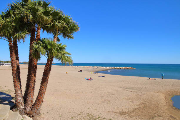 Provincial Spanish beach in spring. The photo was taken in the small Spanish town of Cambrils. The picture shows the city beach in spring. cambrils stock pictures, royalty-free photos & images