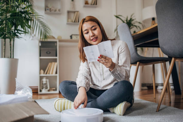 Woman has new robotic vacuum cleaner