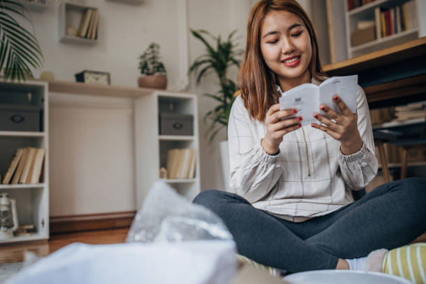 istock Woman reading instruction manual 1486324033