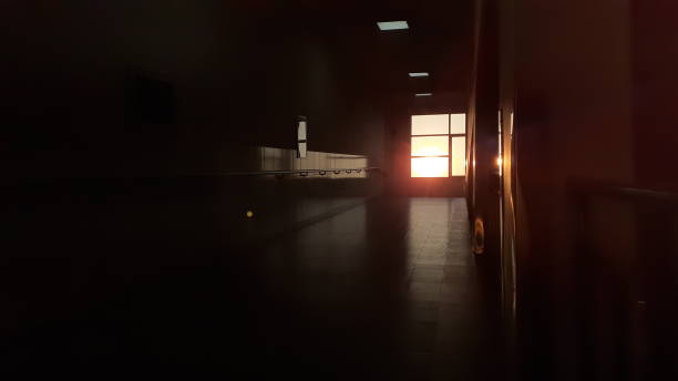 istock A Beautiful Cinematic Shot of a Dark and Empty Corridor with light. 1486324391