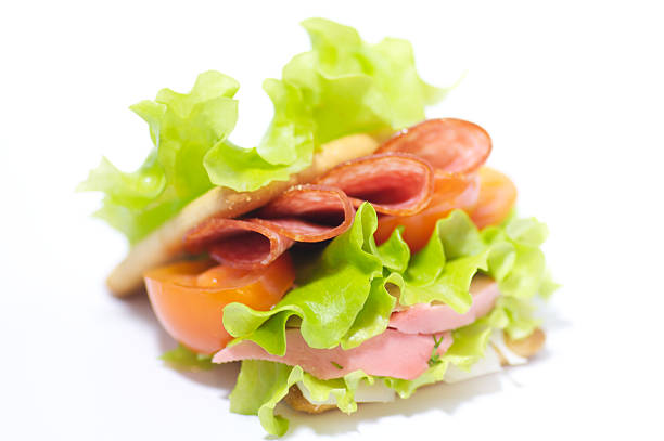 Ham cheese sandwiches on white plates in party