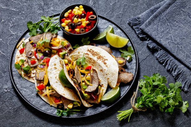 istock Beef Steak Tacos with veggies, avocado, corn 1486331136