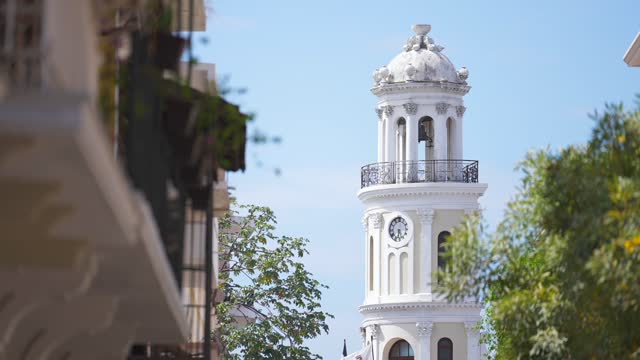 Dominican Republic, Santo Domingo - April 23, 2023: Palacio Consistoral tower view from Arzobispo Merino street, most popular tourist destination in the Colonial Zone