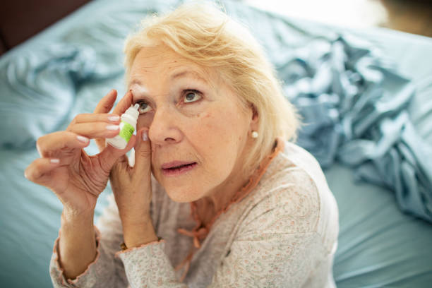 istock Senior woman using eye drops in the bedroom 1486333458