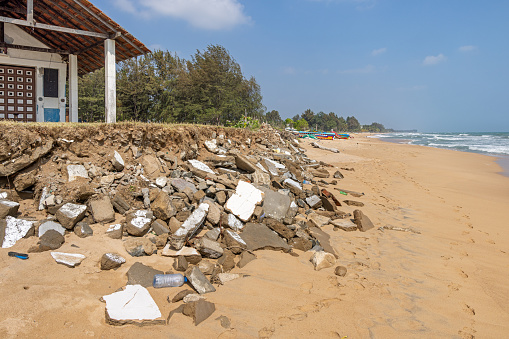 Trincomalee, Eastern Province, Sri Lanka - March 3rd 2023: A landfill consisting of building debris on the popular tropical beach north of the city