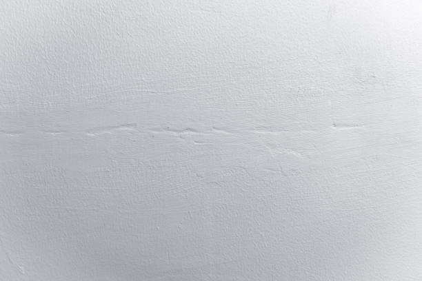 istock abstract for background. Coarse cement plaster wall for white background. Rough textured background. Black and White for old white retro wall background. 1486336843