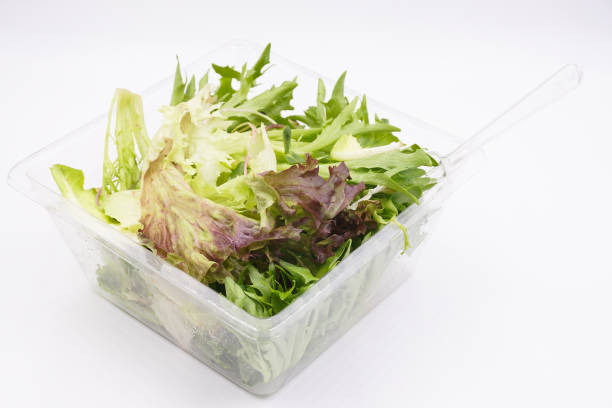 istock Fresh mix green salad in a plastic box 1486338989