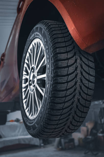 istock Tire tread pattern on car wheels in garage 1486340944