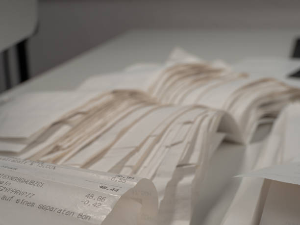 istock Paper cash receipts in a stack of tickets. 1486347132