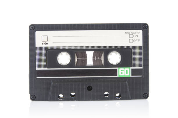 istock Old vintage audio cassette close up isolated on white background 1486347245